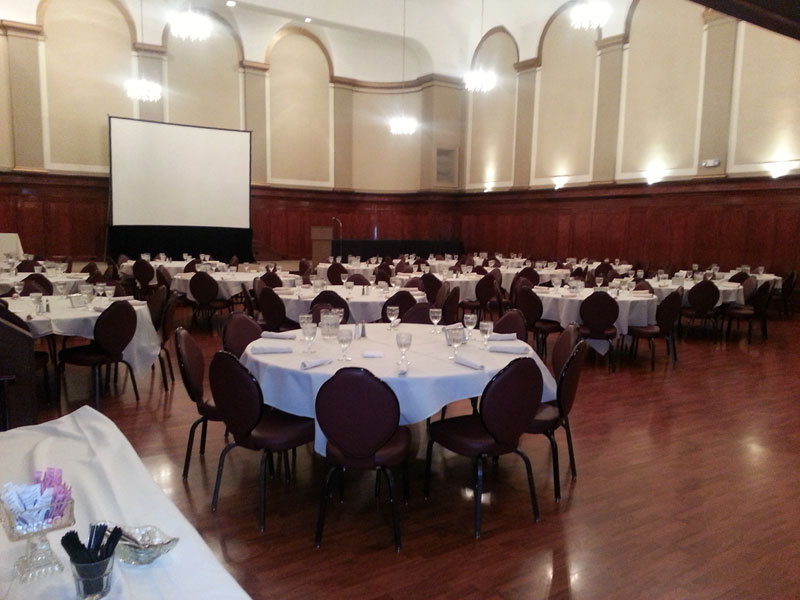 The Corinthian Event Center grand ballroom banquet room setup for a corporate event, view from ballroom.