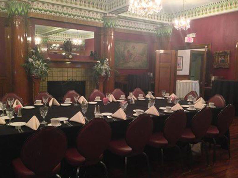 Fireplace banquet room at The Corinthian Event Center setup for a private party.