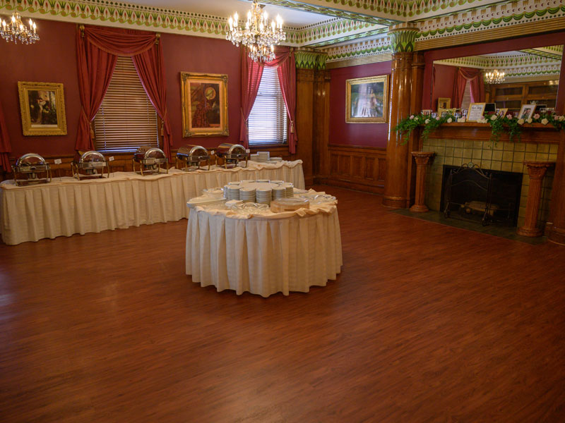 Fireplace banquet room at The Corinthian Event Center setup for a private party.