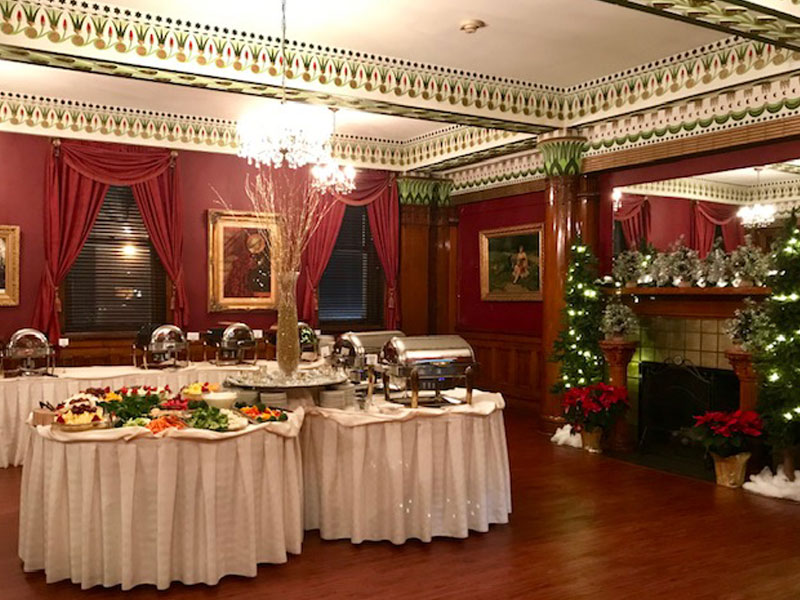 Fireplace banquet room at The Corinthian Event Center setup for a private party.
