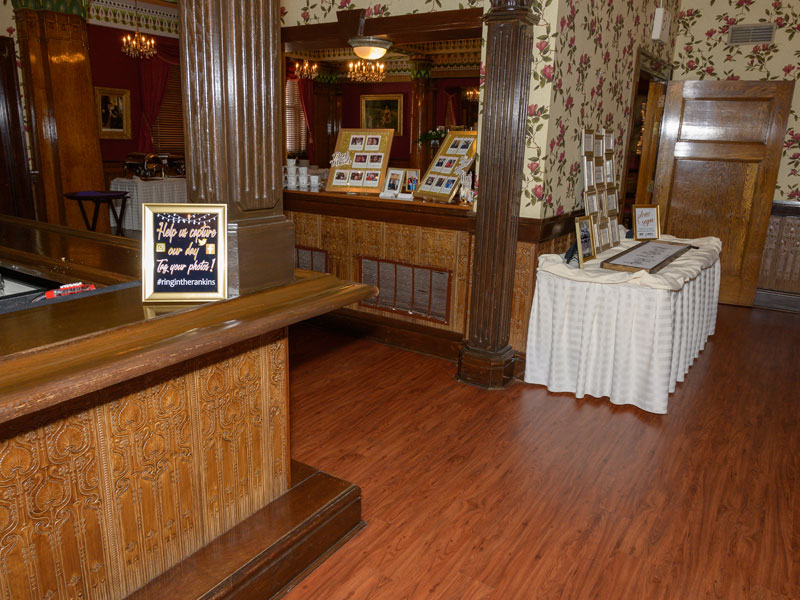 Name card table in the lounge near the Fireplace banquet room at The Corinthian Event Center viewed from the bar.