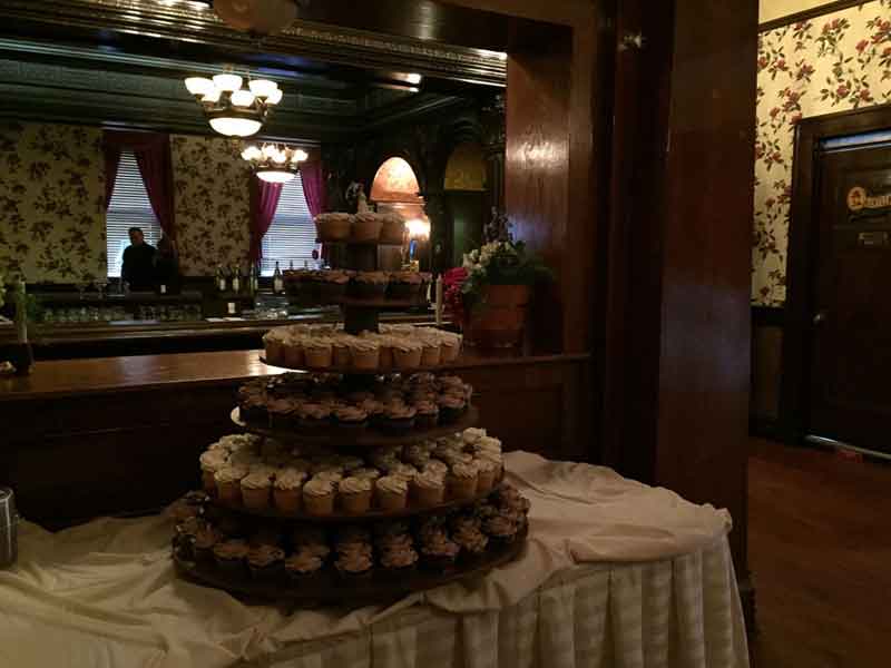 Bride and Groom kiss in the third floor stairway to mezzanine at The Corinthian Event Center.