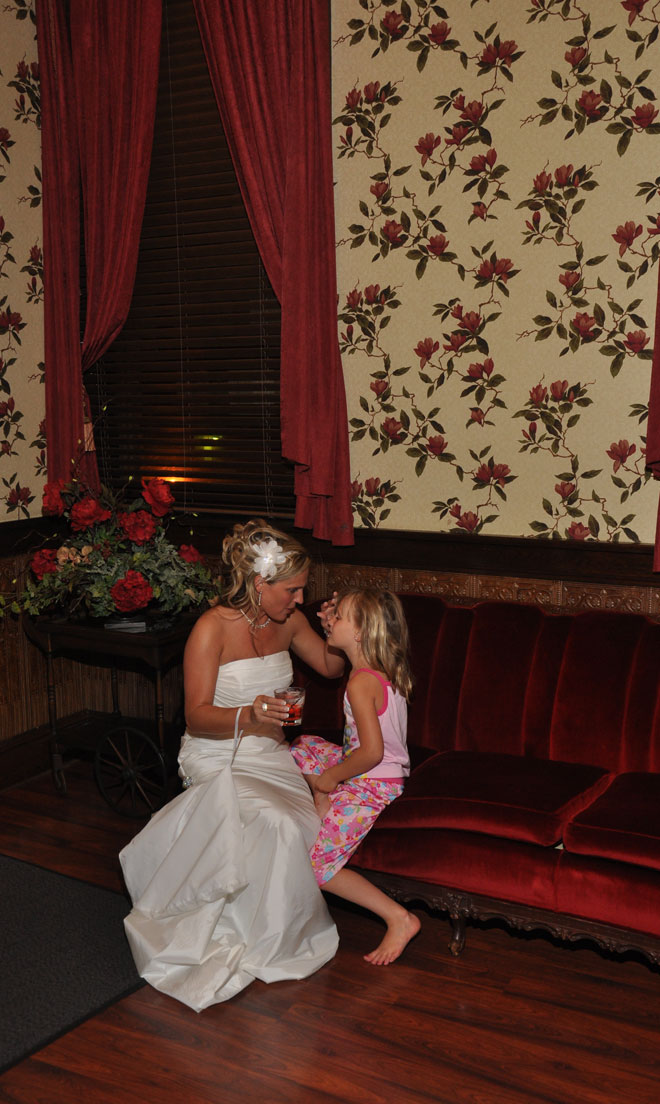 Bride with small child in bridal room at The Corinthian Event Center.