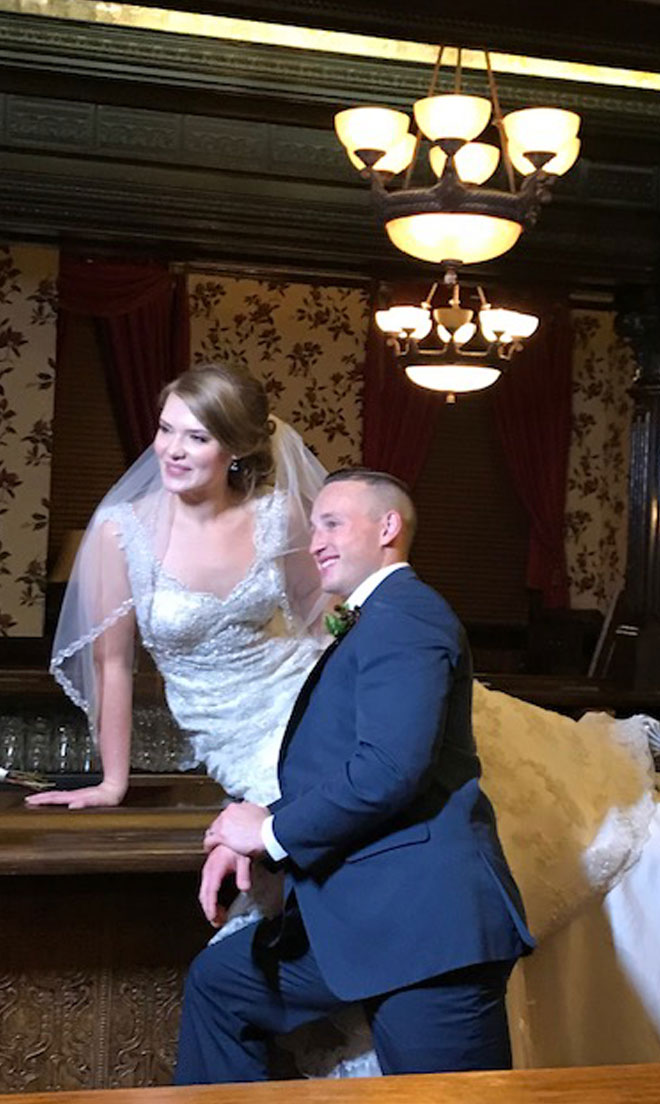 Bride and Groom at bar at The Corinthian Event Center.