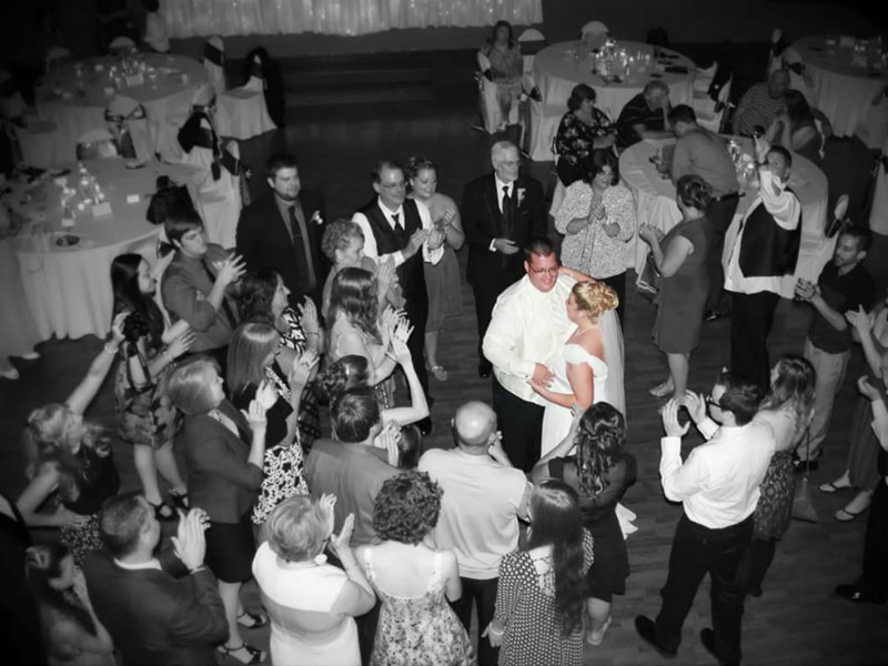 Bride and Groom photo opportunity on dance floor of the Grand Ballroom at The Corinthian Event Center.