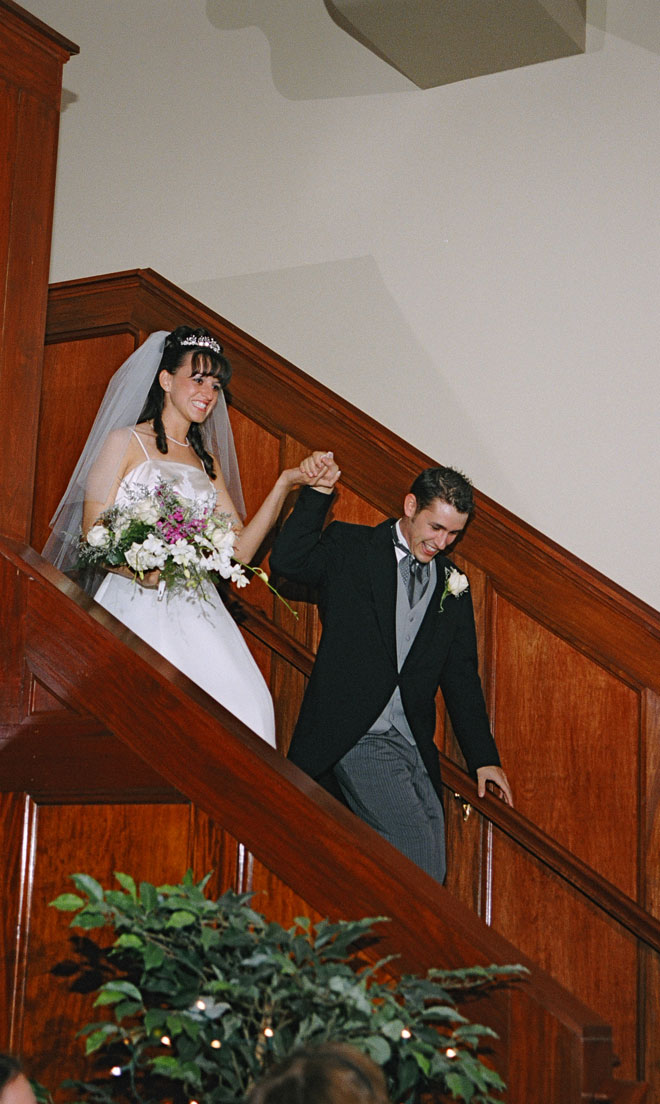 Bride and Groom energetic grand entrance to Grand Ballroom at The Corinthian Event Center.