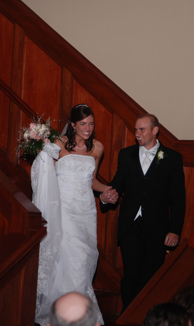 Bride and Groom celebrate as they enter the Grand Ballroom at The Corinthian Event Center.