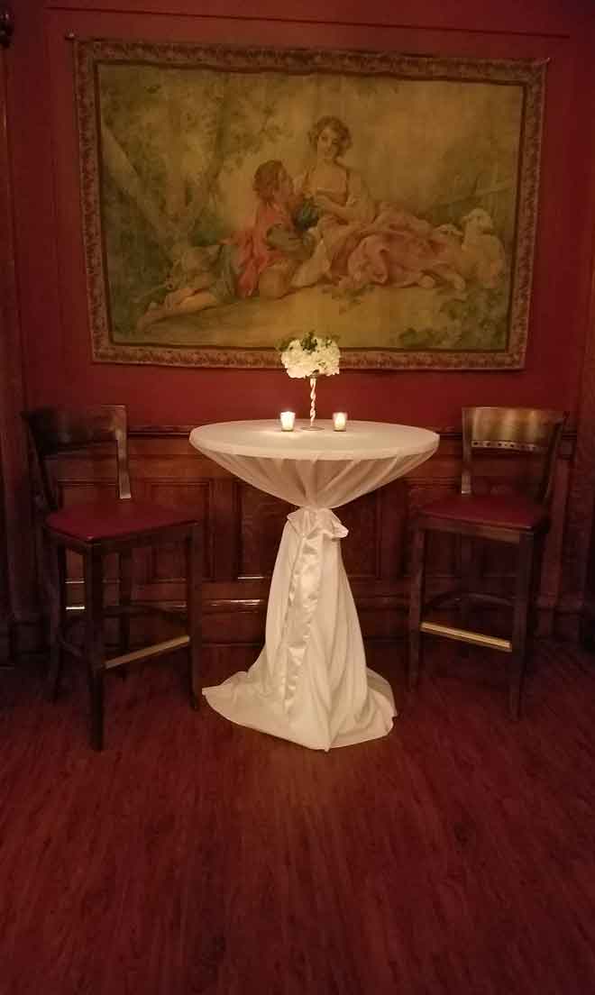 Table in bar banquet room provides decor at The Corinthian Event Center.