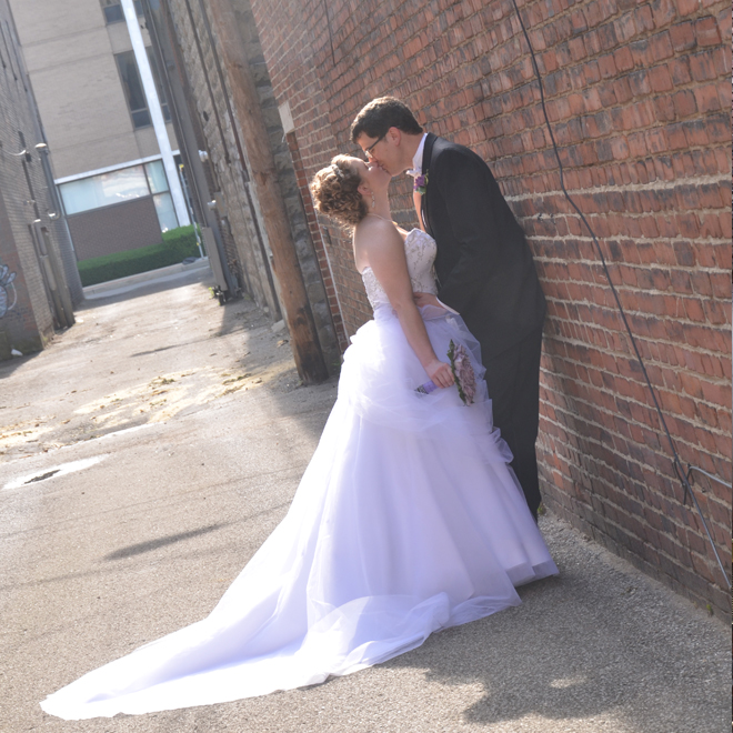 Bride and goom outside of The Corinthinan Events Center.