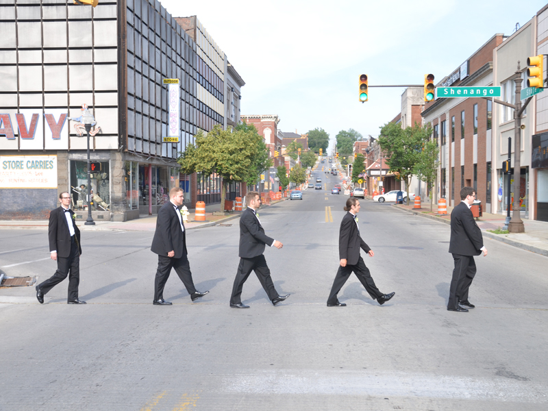 Groomsman in downtown Sharon PA heading to their wedding at The Corinthian Event Center.