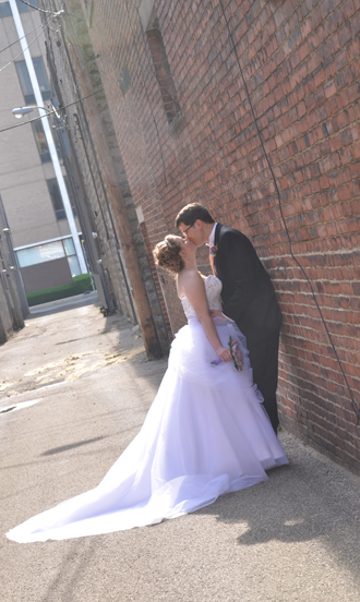 Bride and groom outside The Corinthian Event Center.